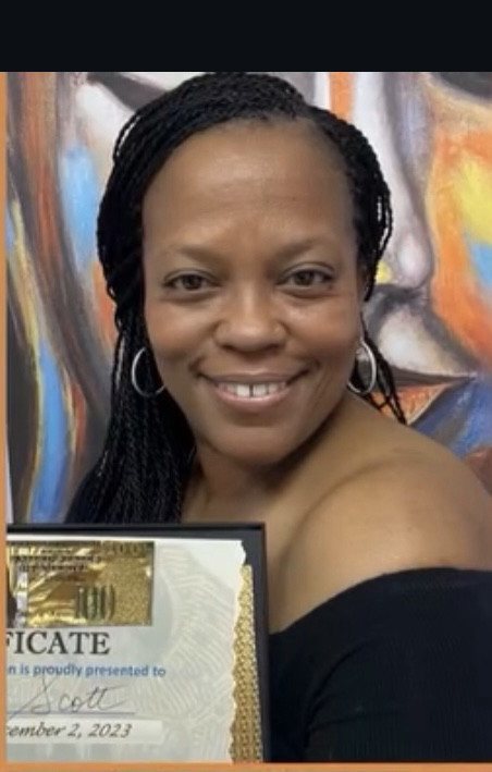 A Reiki Ase graduate smiling with her completion certificate
